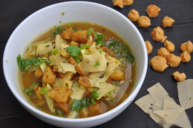 Papad and badi cooked into a spiced curry