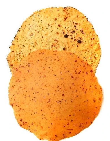 Gram flour papad with visible masala through it