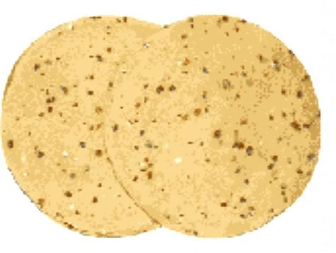 Moong dal papad flecked with whole cumin seed